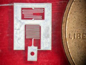 This micro G-force sensor was cut from 25 μm thick aluminum.