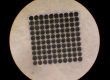 The hole pitch was 120 μm with 5 μm interstitial spacing.